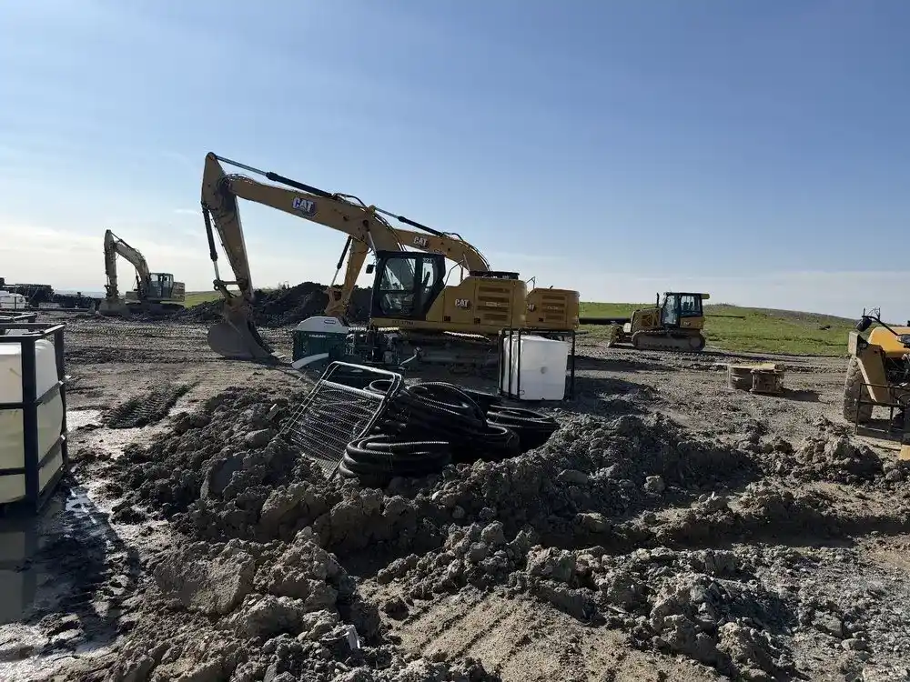 Excavator and heavy equipment on an open jobsite where mobile repair work is done